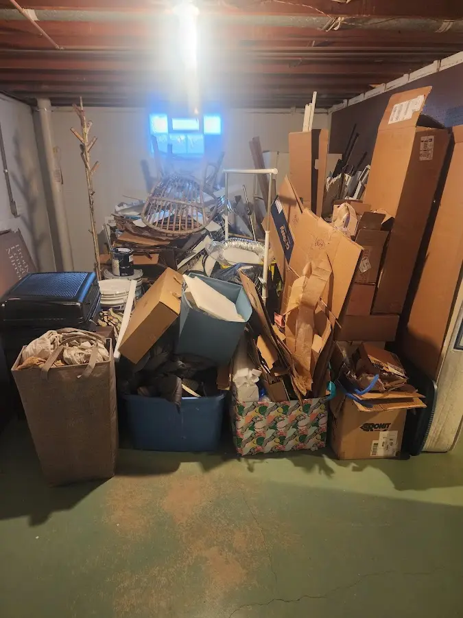 Roll-off dumpster container at job site for 8 Yard Dumpster Rental in Tilden